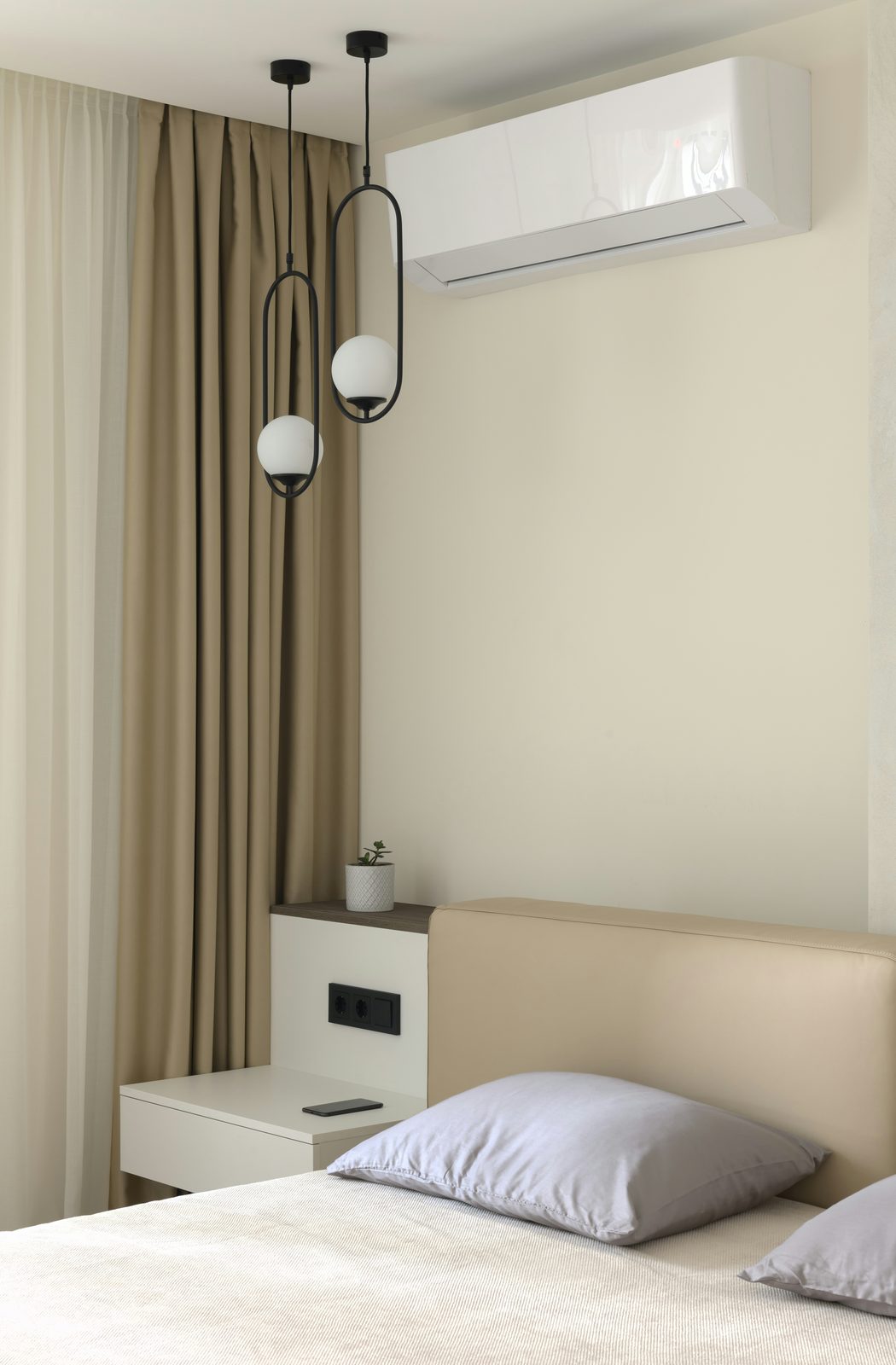 Ductless mini-split heat pump mounted in a modern Nanaimo bedroom