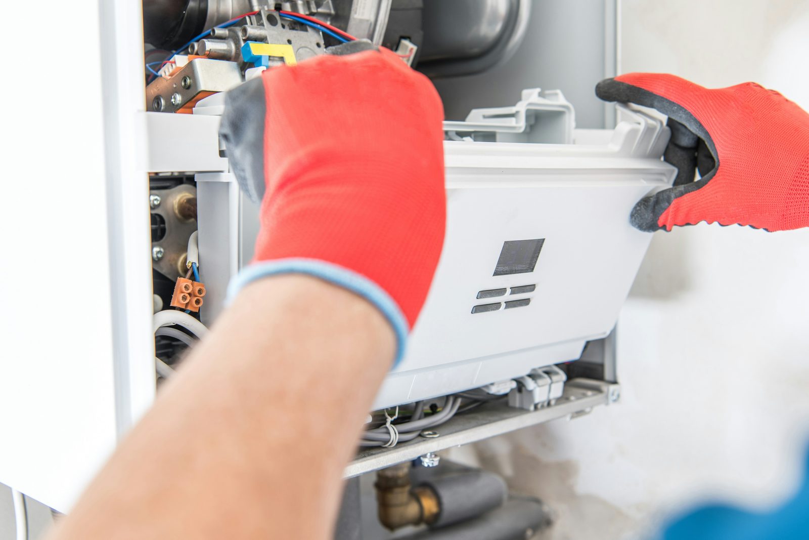 HVAC technician installing a high-efficiency gas furnace in Nanaimo, BC