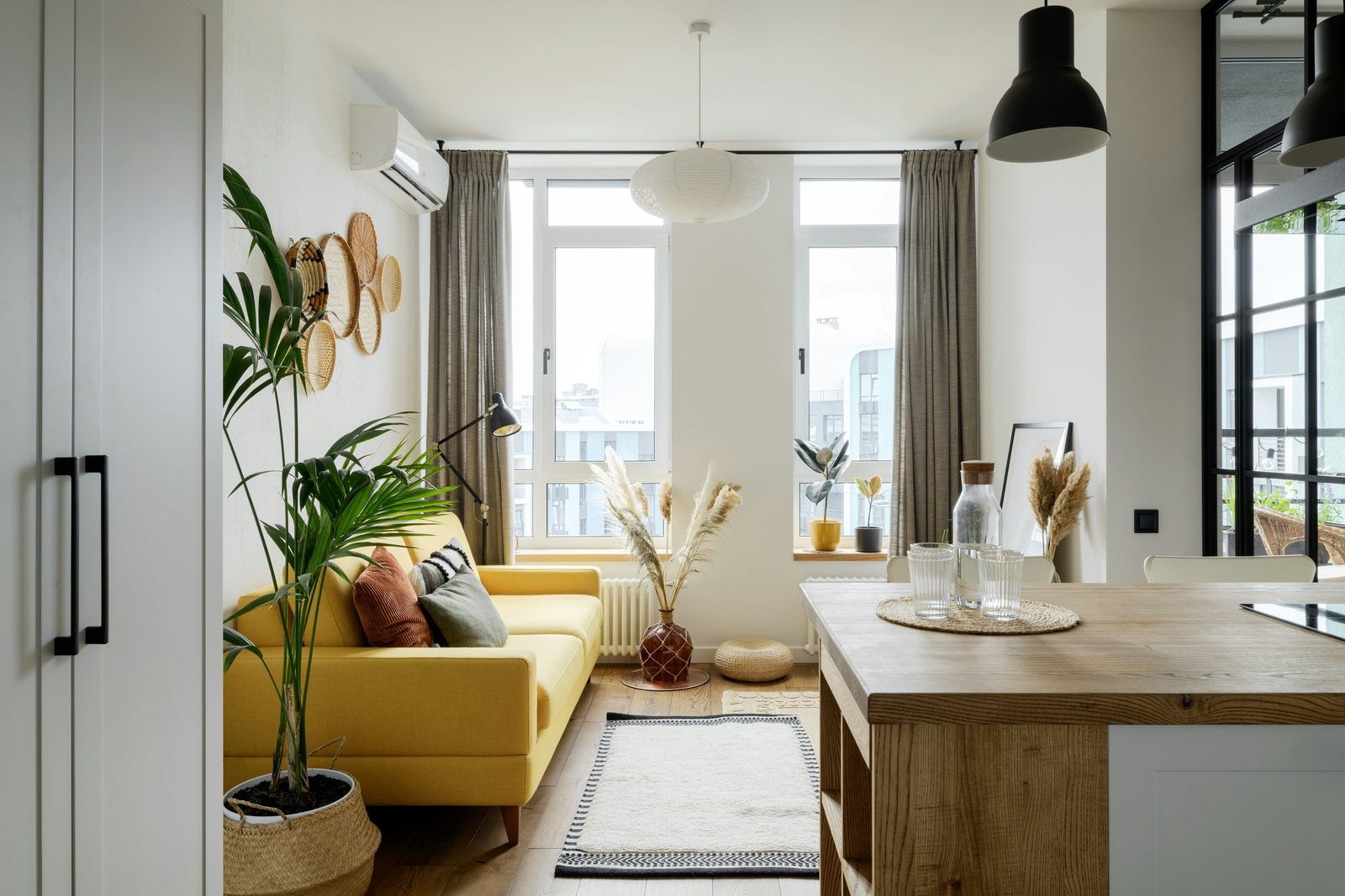 Comfortable rental suite living room with a wall-mounted ductless heat pump